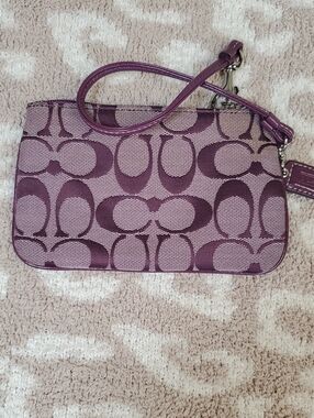Coach Plum Signature Canvas Wristlet with Leather Detail.